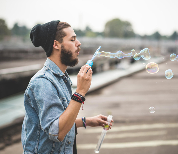 Person blowing bubbles