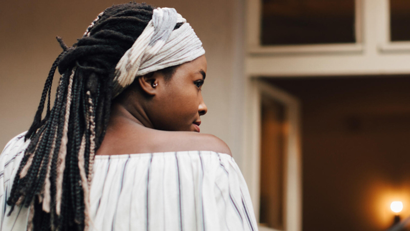 Black woman looking over her shoulder