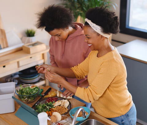 Mother and daughter cooking