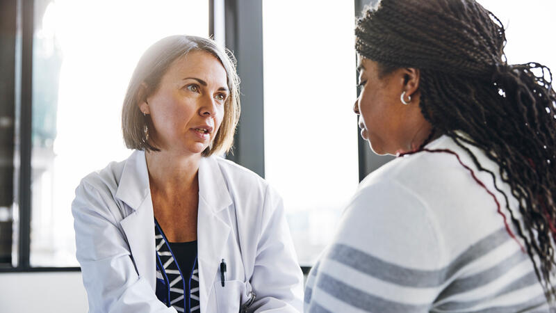 Doctor talking with patient