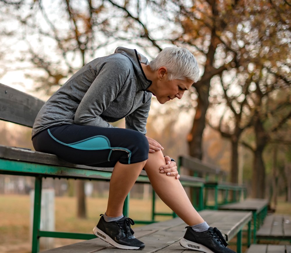 Runner holding their knee