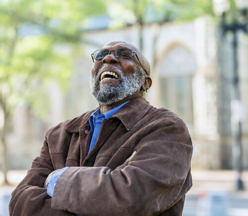 Older Black man laughing