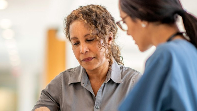 Woman and doctor talking