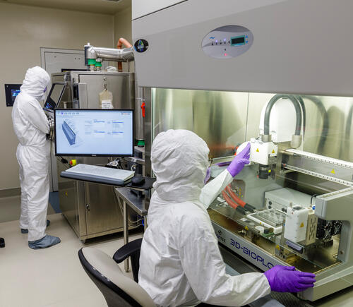 Researchers working in 3D print lab