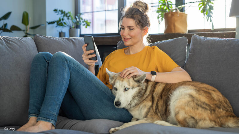 Woman and dog on couch