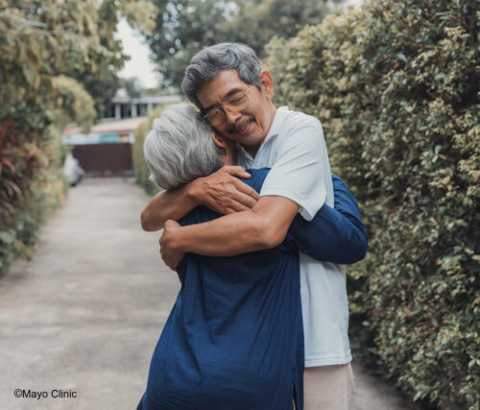 Older couple hugging