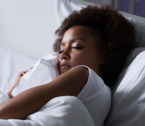 Woman sleeping in bed