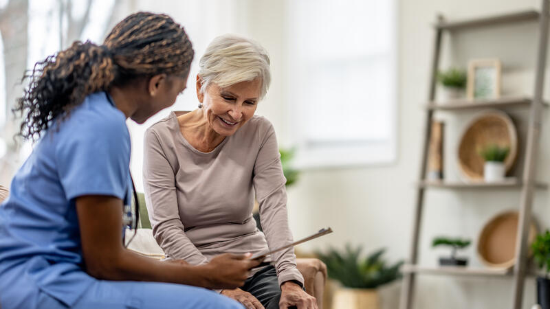 Nurse speaking to patient