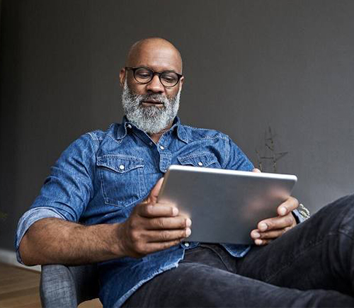 Older man using tablet