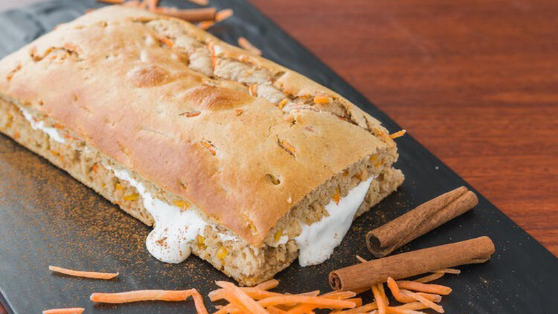 Spiced carrot cake on a cutting board 