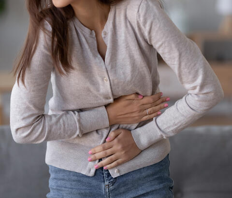 Woman holding her stomach