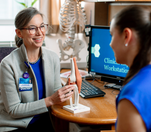 Female physician speaking to patient