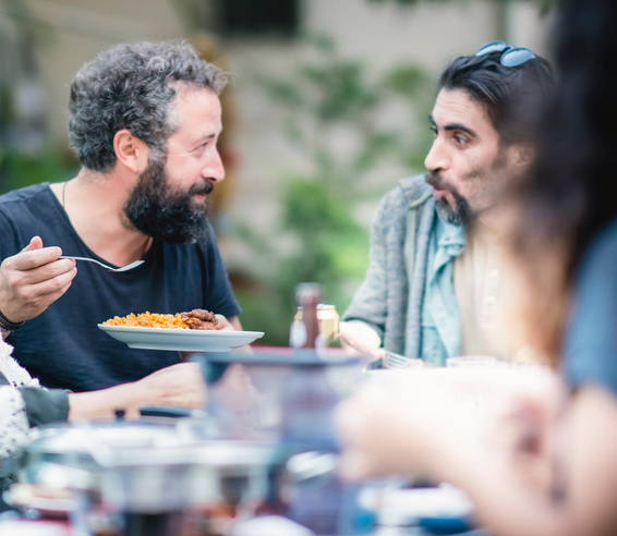 People sharing food outside