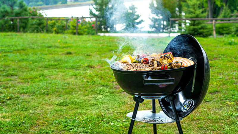 Food cooking on a charcoal grill