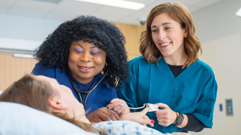 Nurses helping patient