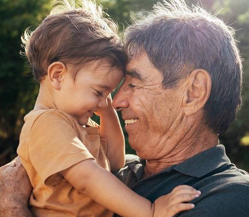 Grandfather holding grandkid