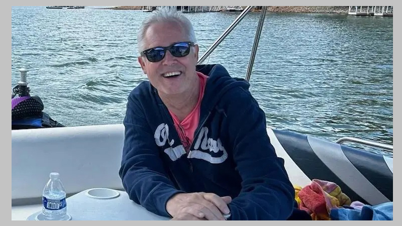 Photo of patient Brian on a boat