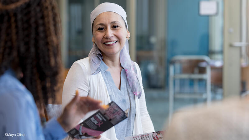 Cancer survivor talking with provider