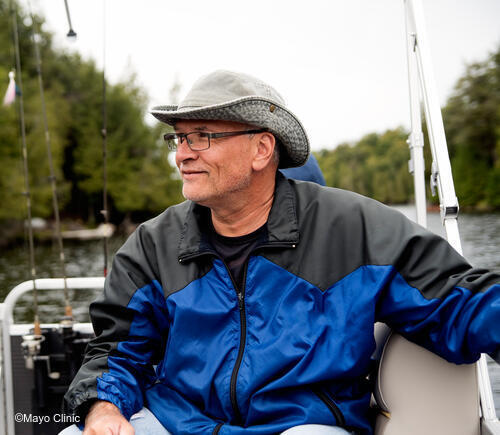 Man smiling in his fishing boat