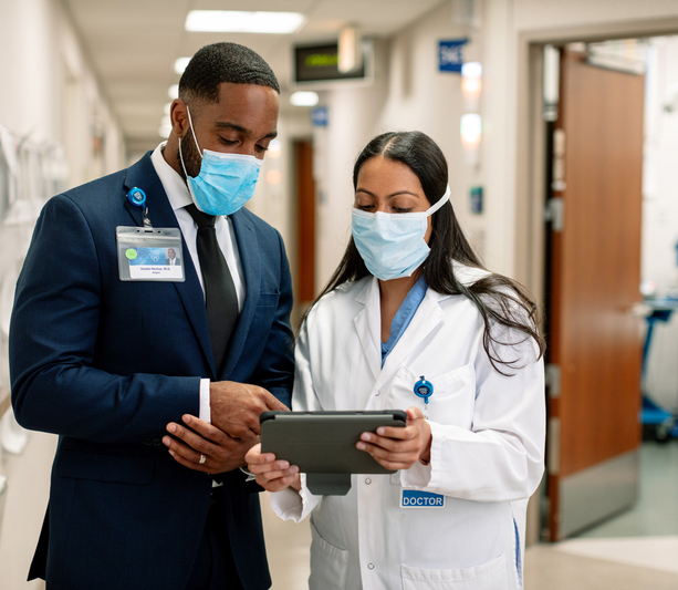 Doctors consulting on tablet 