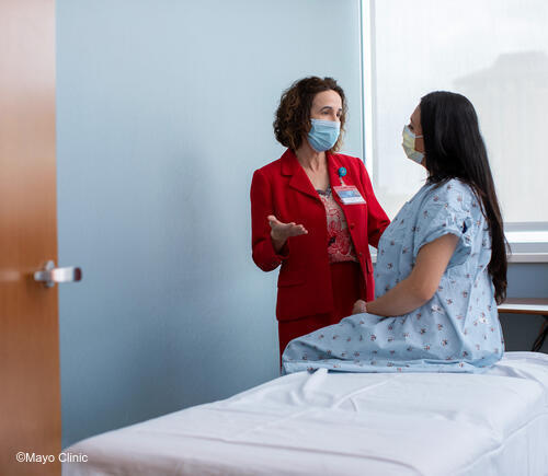 Female physician with female patient.