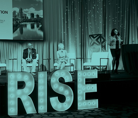 Professionals on stage at RISE conference.