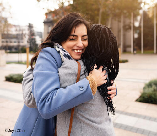 Two friends embracing