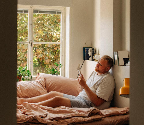 Man reading in bed