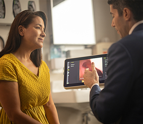 Physician showing a patient a video