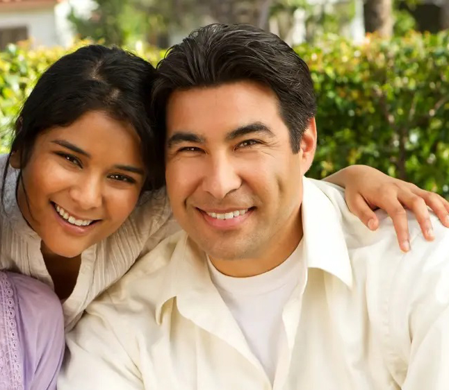 Father and daughter smiling