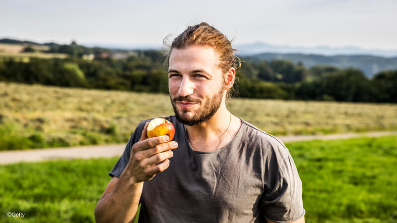 Man eating apple