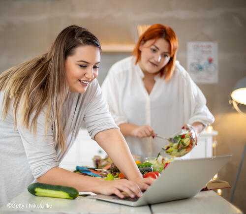 Two women cooking in the kitchen