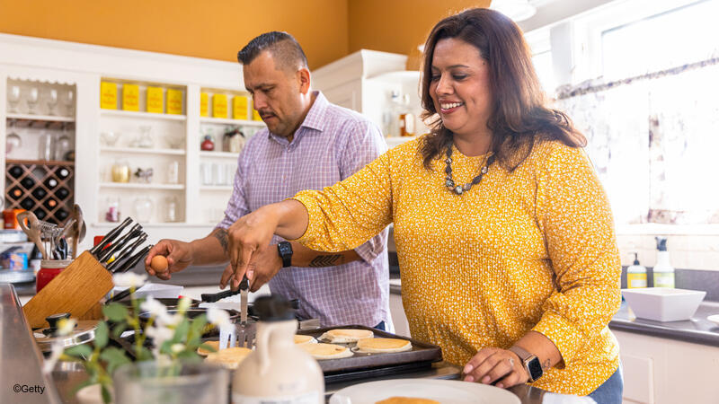 Couple making breakfast together