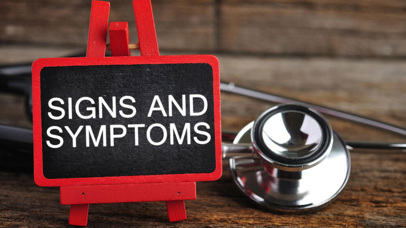 Signs and Symptoms sign on a desk with stethoscope