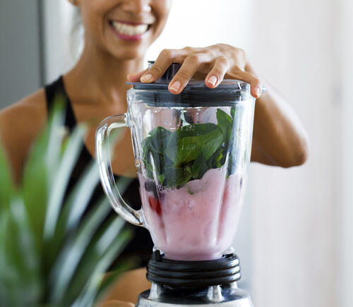 Woman making a smoothie