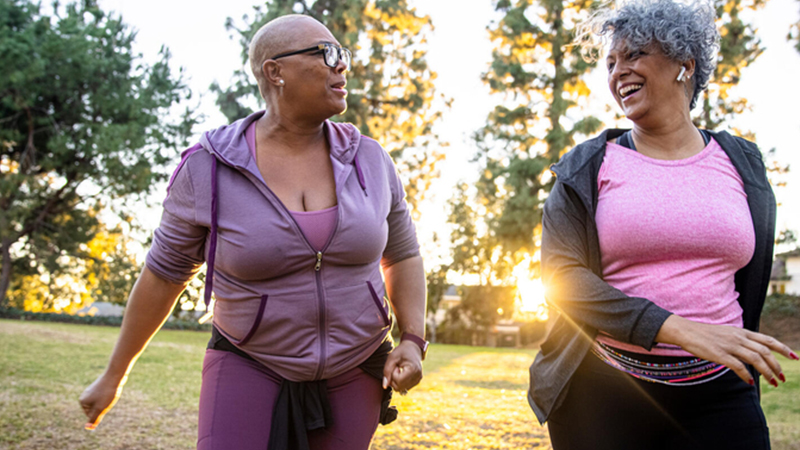 Two women walking in the park